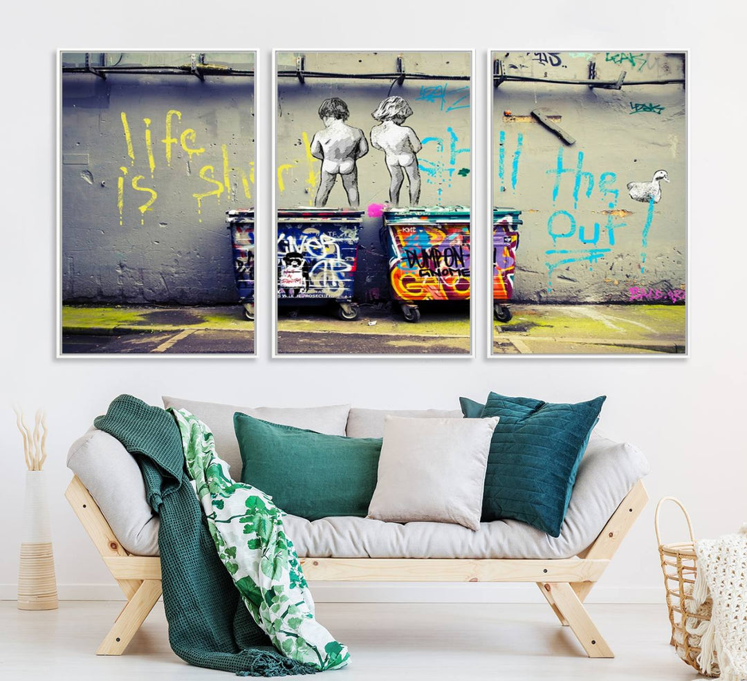 Banksys Life is Short graffiti, featuring kids and text, decorates the wall as a striking piece of framed canvas art.