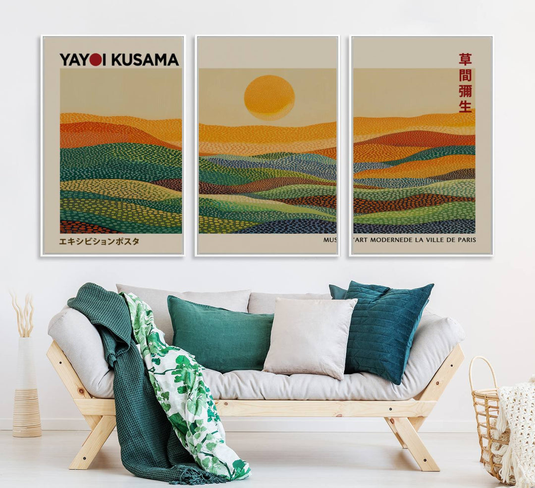 A framed Yayoi Kusama 1986 wall art print showcases a vibrant abstract landscape with colorful, wavy dots and a sun above the horizon.