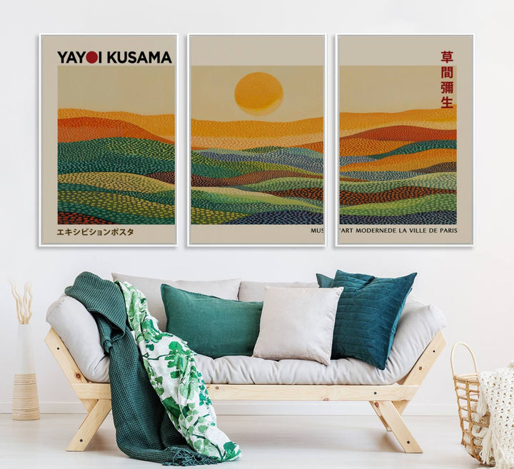 A framed Yayoi Kusama 1986 wall art print showcases a vibrant abstract landscape with colorful, wavy dots and a sun above the horizon.