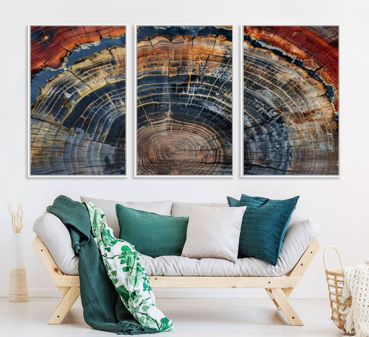 The Abstract Tree Ring Wall Art in orange, blue, and gray perfectly complements minimalist nature-inspired home decor.