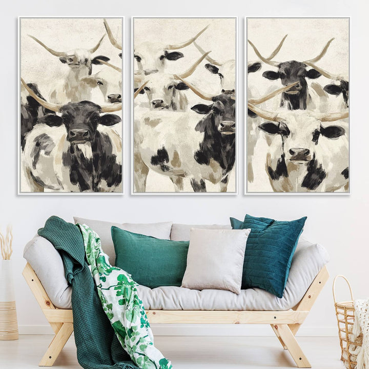 Canvas print titled Longhorn Texas Cow Drawing, depicting longhorn cattle with black and white markings, made in the USA, displayed on the wall.