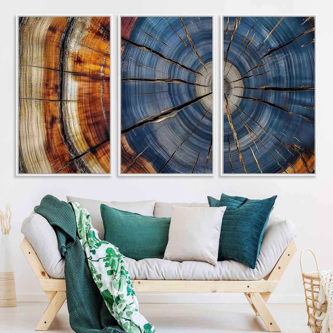 Close-up of blue, brown, and orange wood grain rings on the Abstract Tree Rings Canvas Wall Art Print.