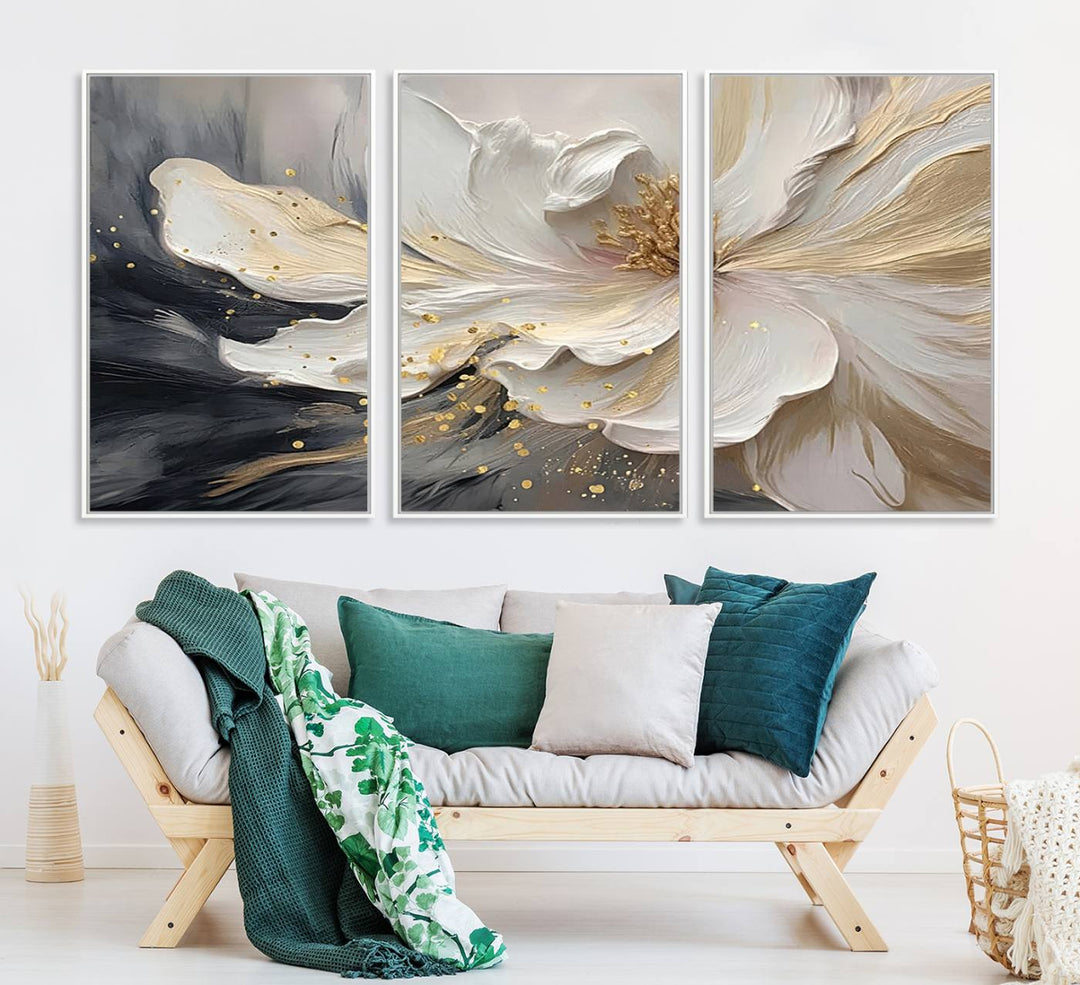 Elegant White and Gold Floral Triptych Canvas Art, a modern textured flower painting for home or office decor, features a blurred gray background.