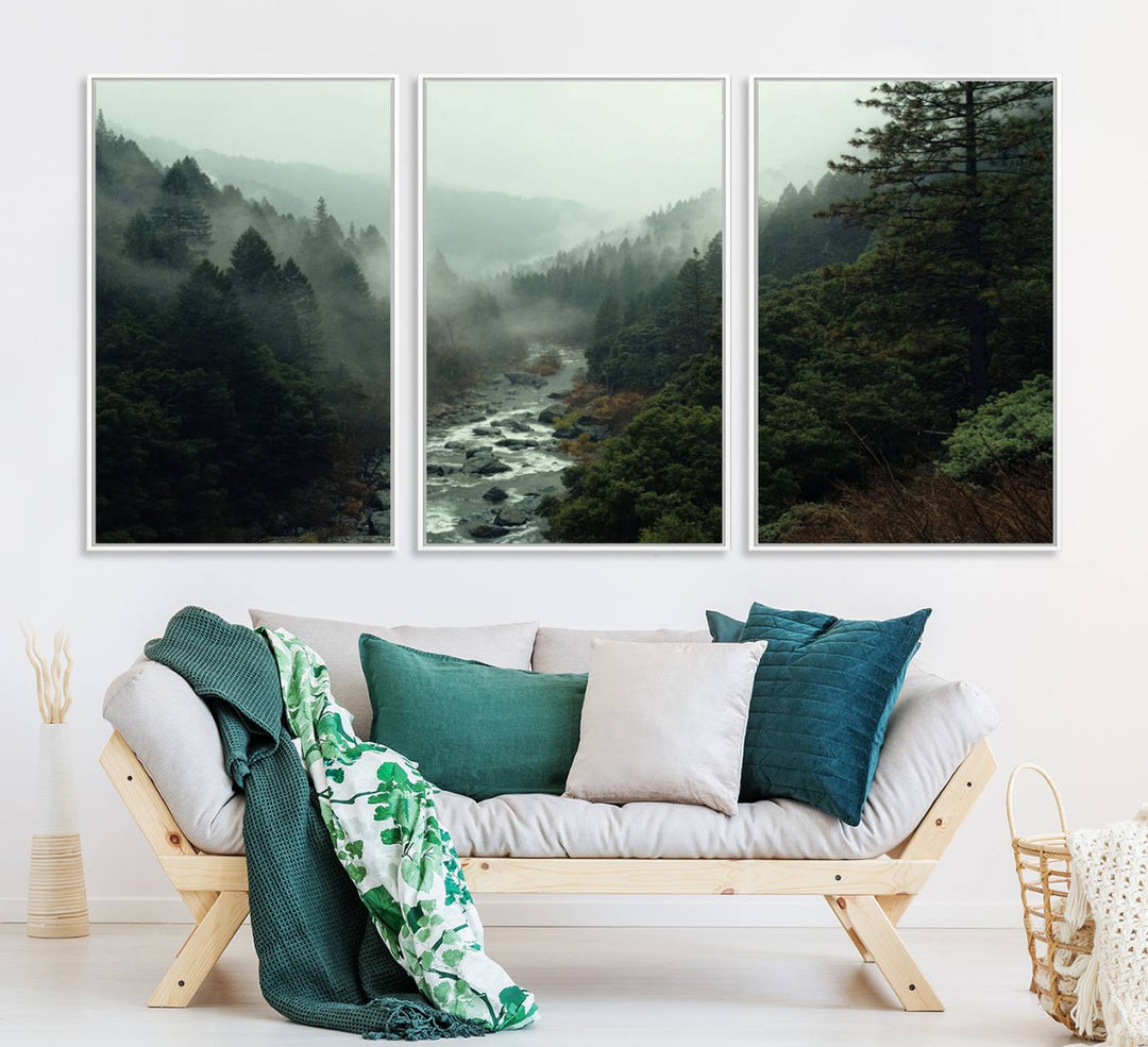 The Misty Forest Wall Art features a serene landscape with a misty river and evergreens, ideal for enhancing the ambiance of any living room or cabin.