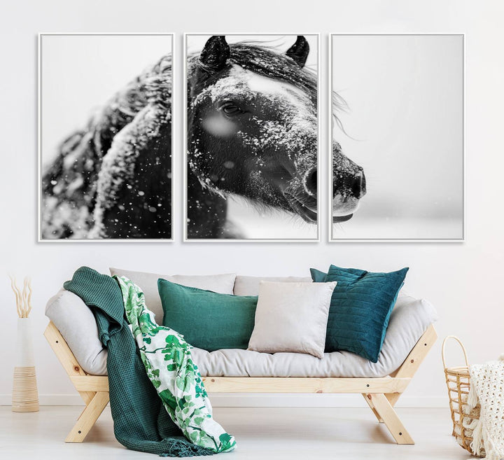 A large 3-panel rustic farmhouse wall art showcases a black and white winter horse canvas print against a snowy backdrop.