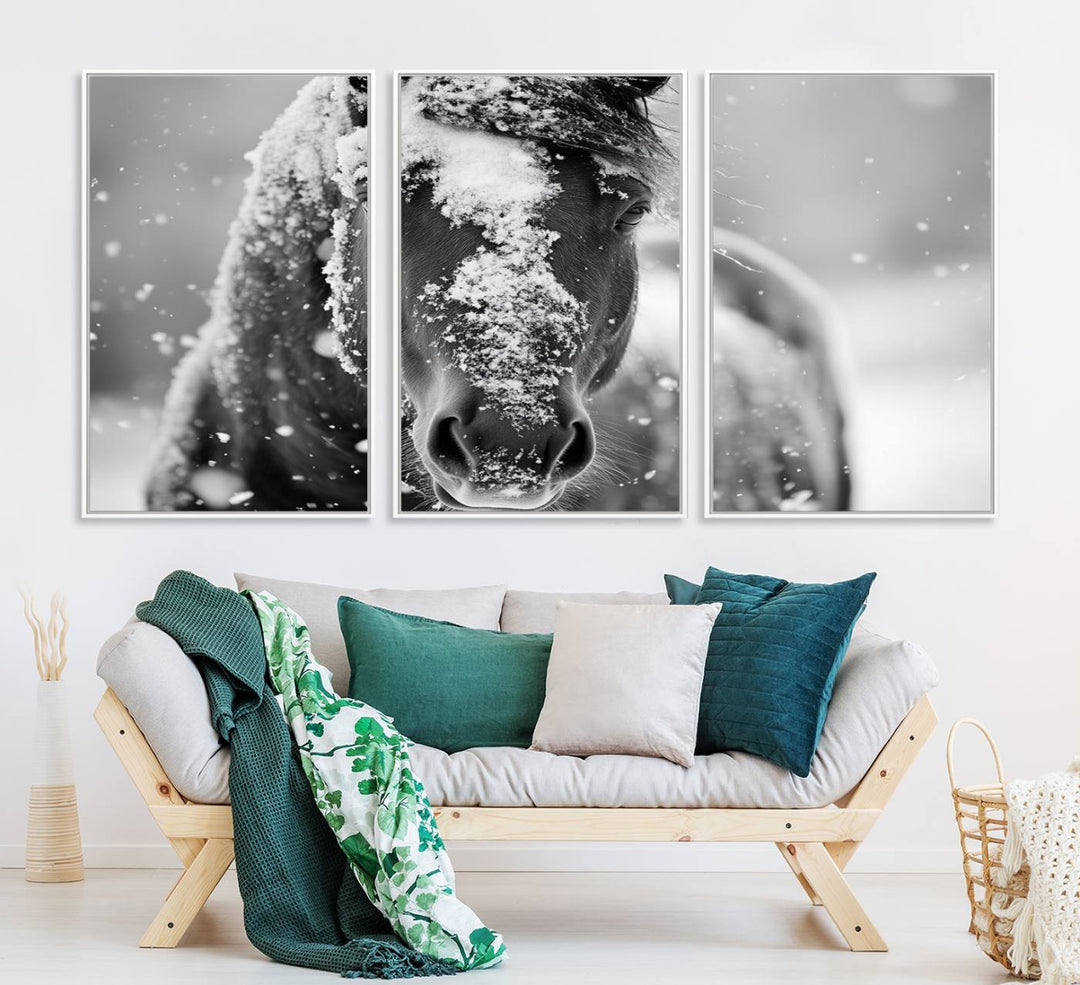 The Black and White Horse Winter Wall Art features a majestic horse with snow-covered hair set against a serene winter backdrop.