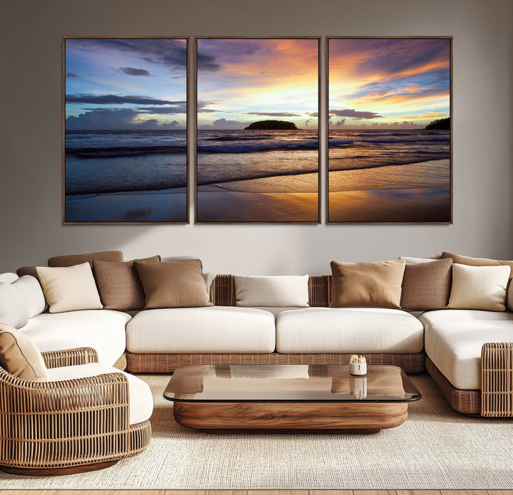 A tropical beach at sunset with waves gently washing ashore, reflecting golden and purple hues in the sky, creating a tranquil coastal scene.