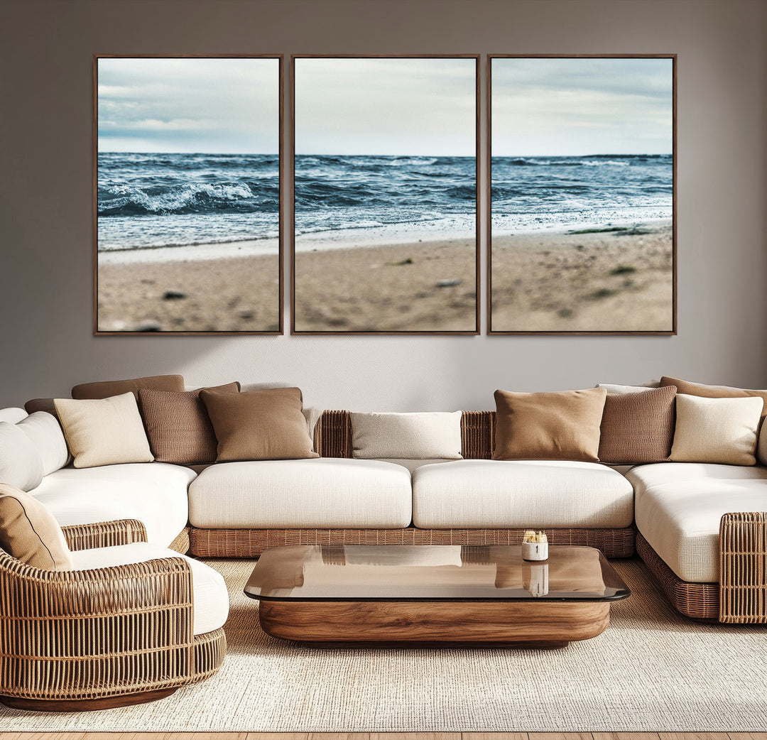 A moody ocean scene with gentle waves washing onto a sandy beach under a cloudy sky, creating a peaceful and coastal atmosphere.