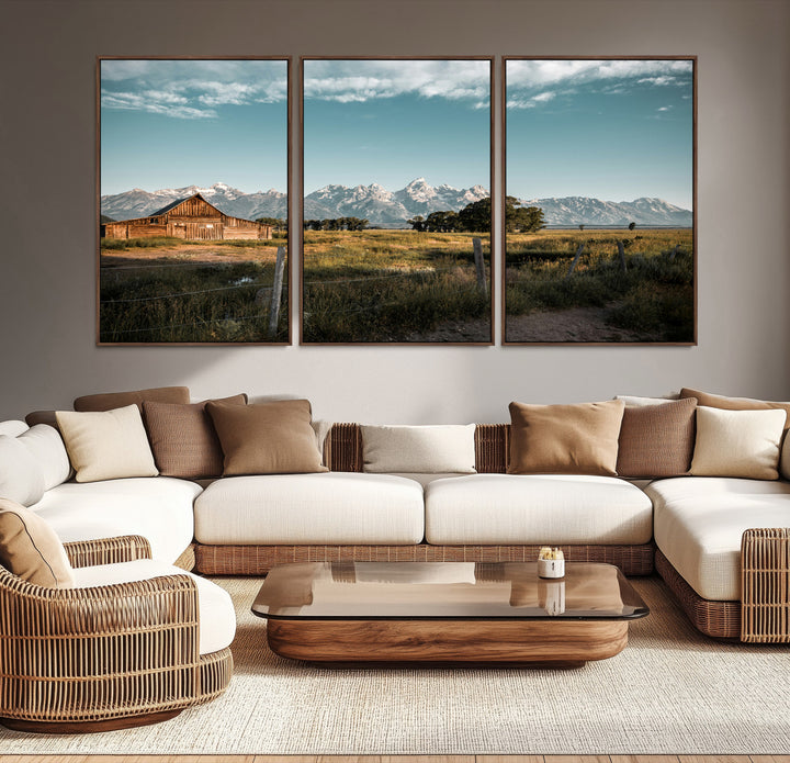 A rustic farmhouse with a wooden barn set against majestic mountain peaks under a soft blue sky, evoking peaceful countryside charm.