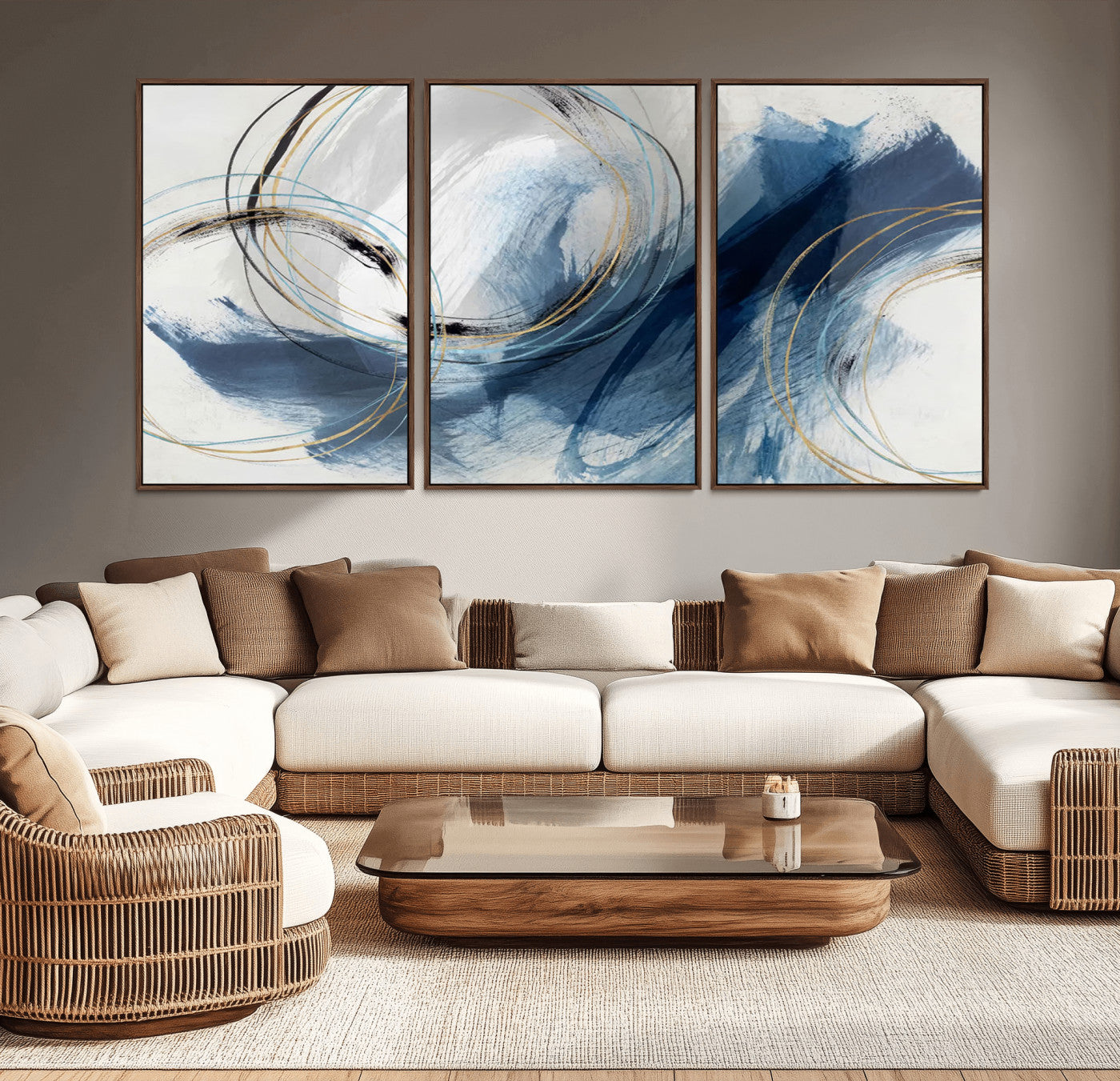 Abstract wall art featuring dynamic brush strokes in shades of blue and gray, overlaid with delicate circular line patterns in gold, black, and light blue on a white background.