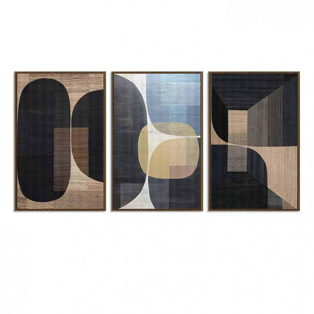 Abstract geometric wall art featuring black, gray, beige, and blue tones framed in a wooden border.