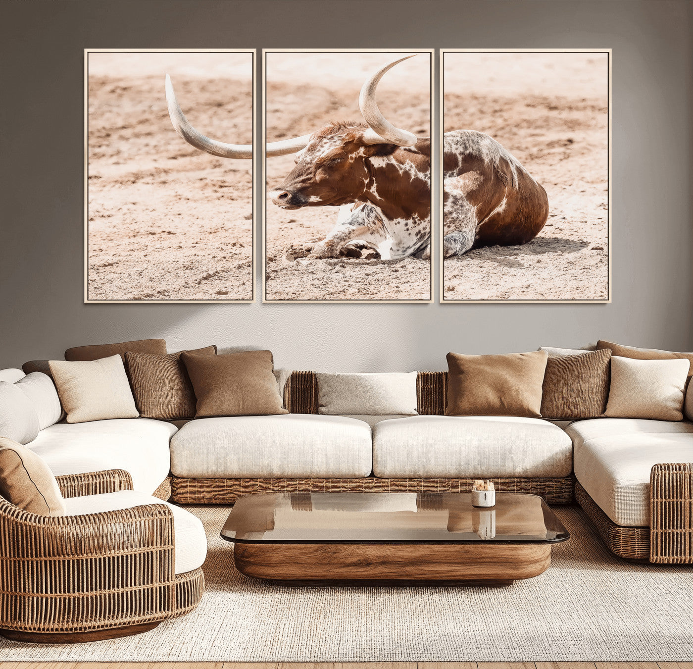 Texas Longhorn bull resting on dusty ground with warm tones, ideal for rustic western or farmhouse-themed wall decor.