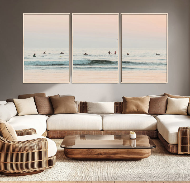 Dreamy photo of surfers waiting on soft pastel waves under a pink sunset sky, ideal for soft coastal minimalist or serene ocean-themed home decor.