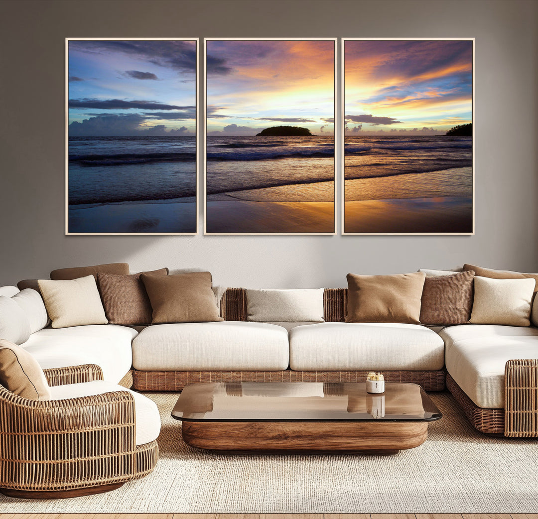 A tropical beach at sunset with waves gently washing ashore, reflecting golden and purple hues in the sky, creating a tranquil coastal scene.