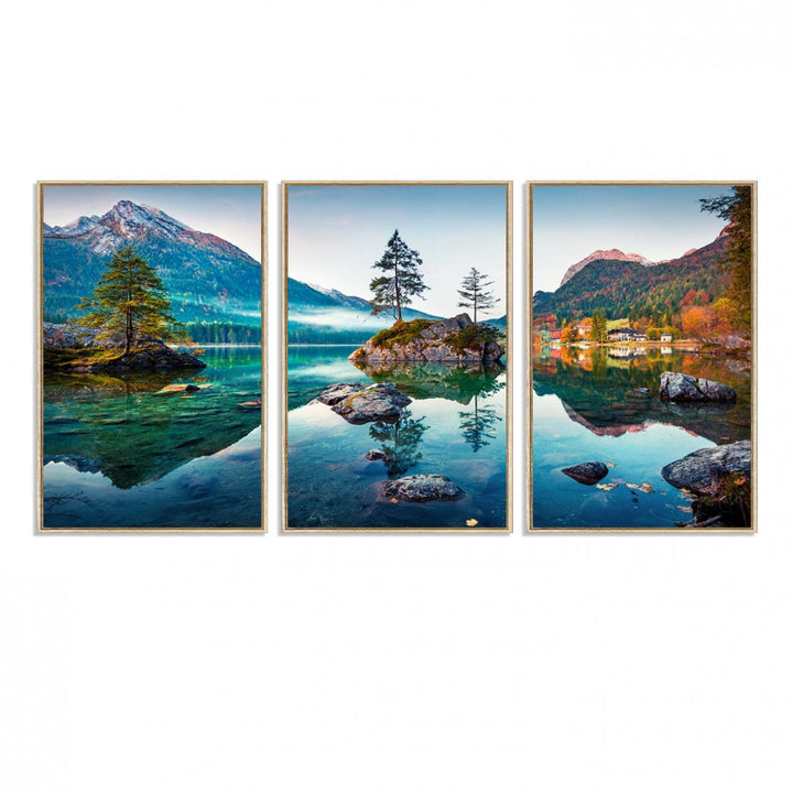 The 3-panel wall art showcases a serene mountain lake with rocky islands and trees, creating an ideal focal point for dining rooms or offices.