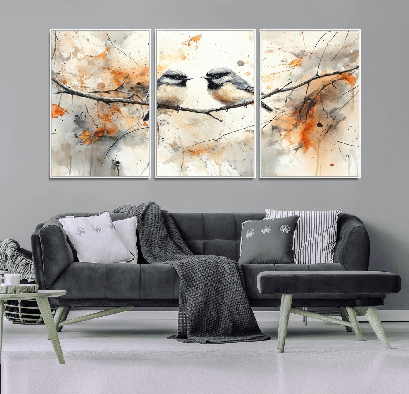 A soft and elegant watercolor painting of two chickadees perched on a delicate branch, surrounded by splashes of orange and neutral tones evoking a calm autumn day.