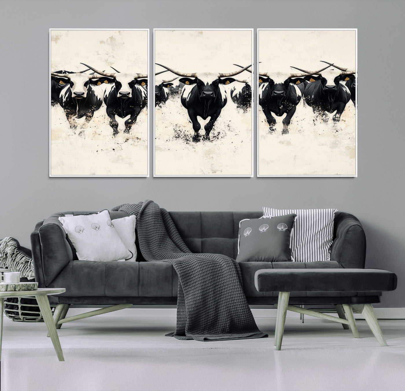 Canvas artwork of black and white Texas longhorns in a bold stampede over a minimalist background, ideal for rustic modern or Western-themed decor.
