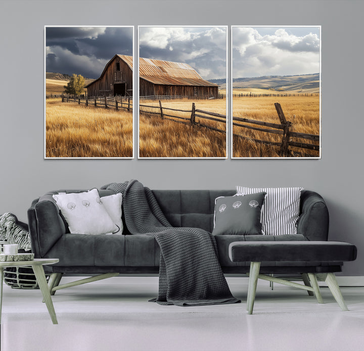 Canvas of a weathered wooden barn in a golden field under a dramatic sky, perfect for rustic or farmhouse-style wall decor.