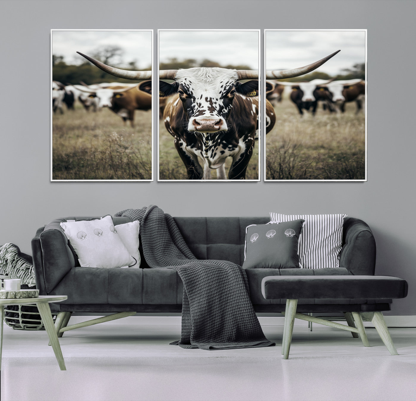 Canvas of a speckled Texas longhorn standing boldly in a field with a herd behind, perfect for rustic western or farmhouse wall decor.