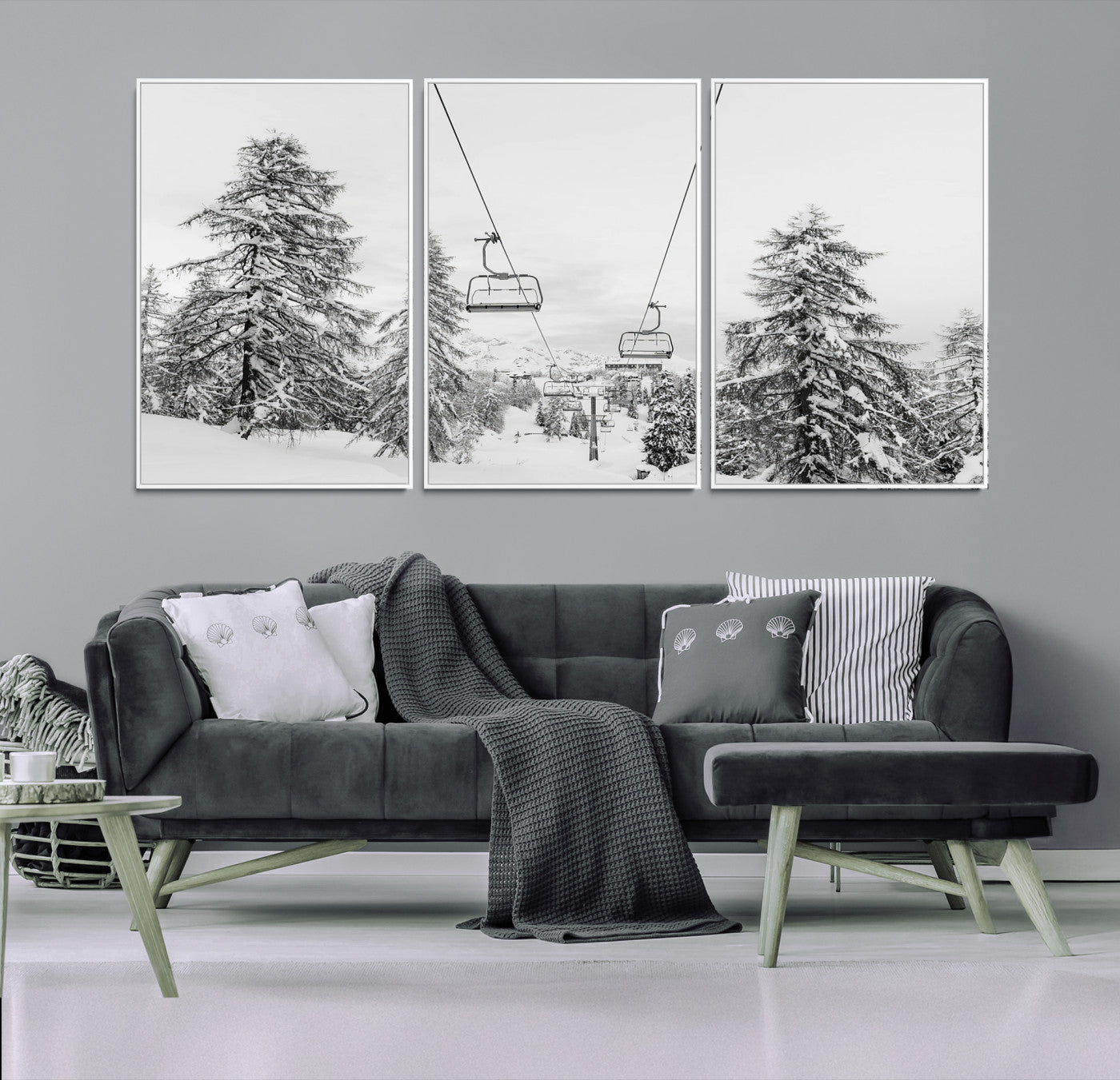 Black and white image of a ski lift amidst snow-covered pine trees, ideal for winter mountain or cabin-themed decor.