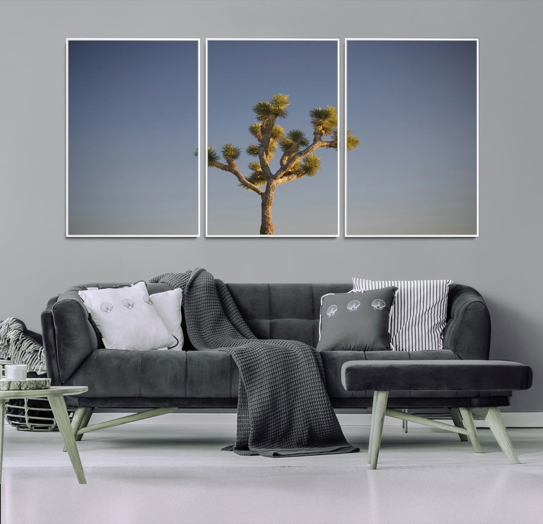 A lone Joshua Tree standing against a deep blue sky, capturing the serene and rugged beauty of the Southwestern desert landscape.