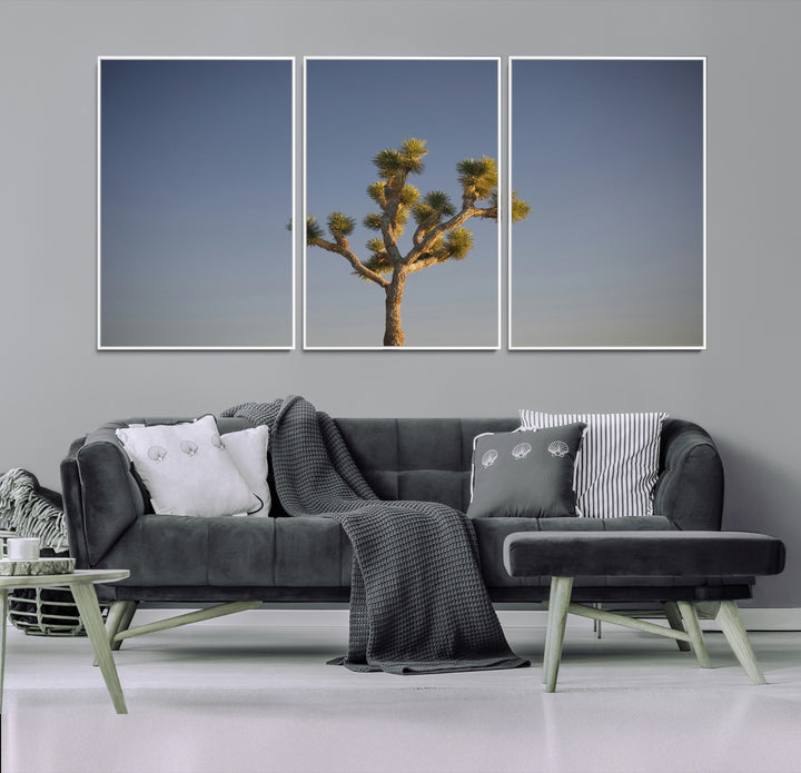 A lone Joshua Tree standing against a deep blue sky, capturing the serene and rugged beauty of the Southwestern desert landscape.