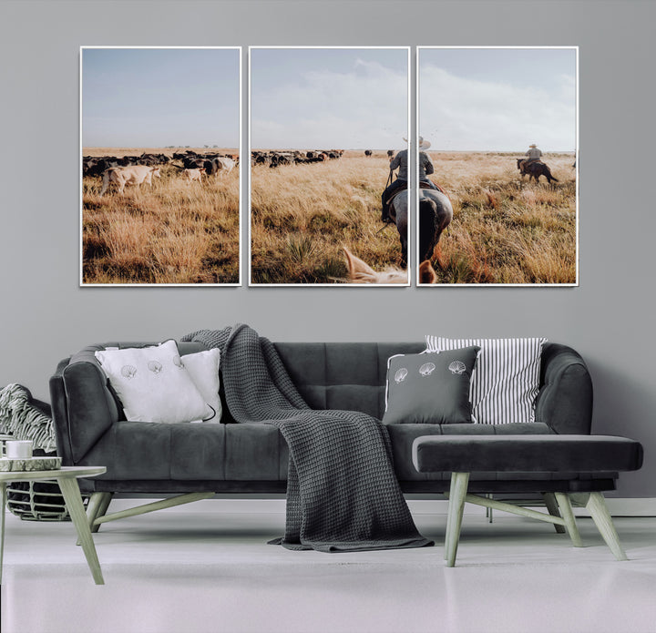 A cowboy and cowgirl on horseback herding cattle through golden grasslands, capturing a rustic and authentic Western ranch lifestyle.