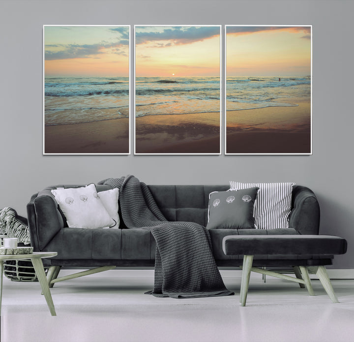 Warm sunset over gentle ocean waves with pastel sky and reflections on wet sand, creating a calm and soothing beach ambiance.