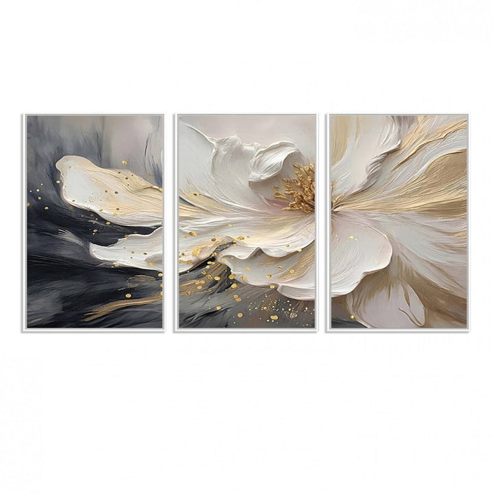 Elegant White and Gold Floral Triptych Canvas Art, a modern textured flower painting for home or office decor, features a blurred gray background.