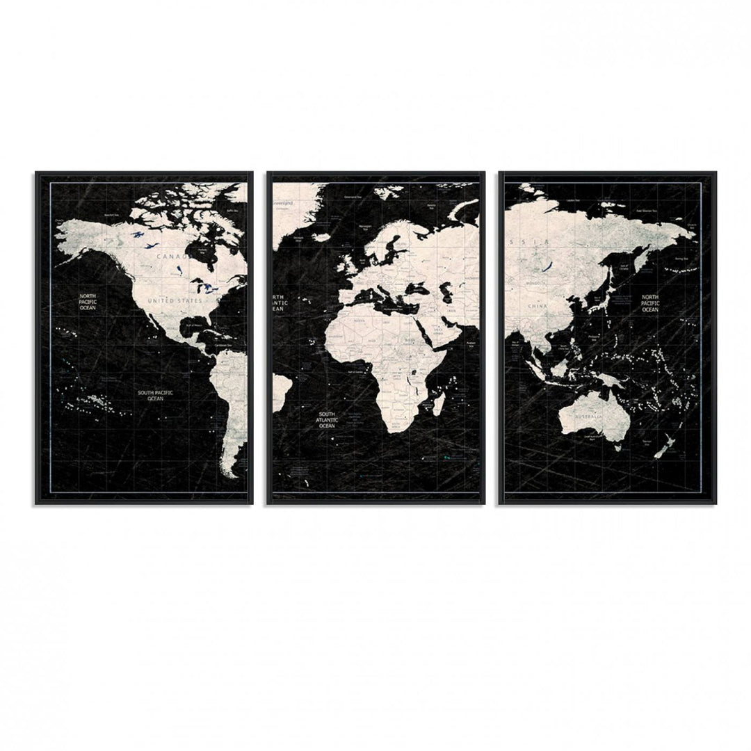 A bold global style framed black and white world map canvas print, presented in three panels, perfect for modern home or office decor.