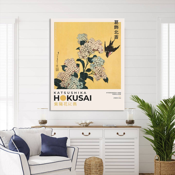 The Katsushika Hokusai Hydrangea and Swallow Canvas Wall Art Print highlights elegant Japanese floral art with a swallow, beautifully displayed against a textured wall. Ideal for adding charm to your living room, bedroom, or office.