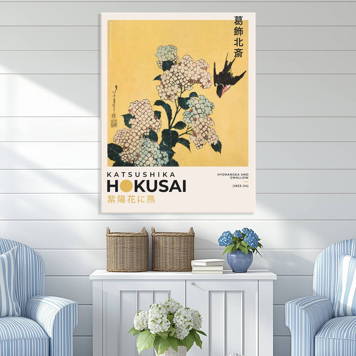 The Katsushika Hokusai Hydrangea and Swallow Canvas Wall Art Print highlights elegant Japanese floral art with a swallow, beautifully displayed against a textured wall. Ideal for adding charm to your living room, bedroom, or office.