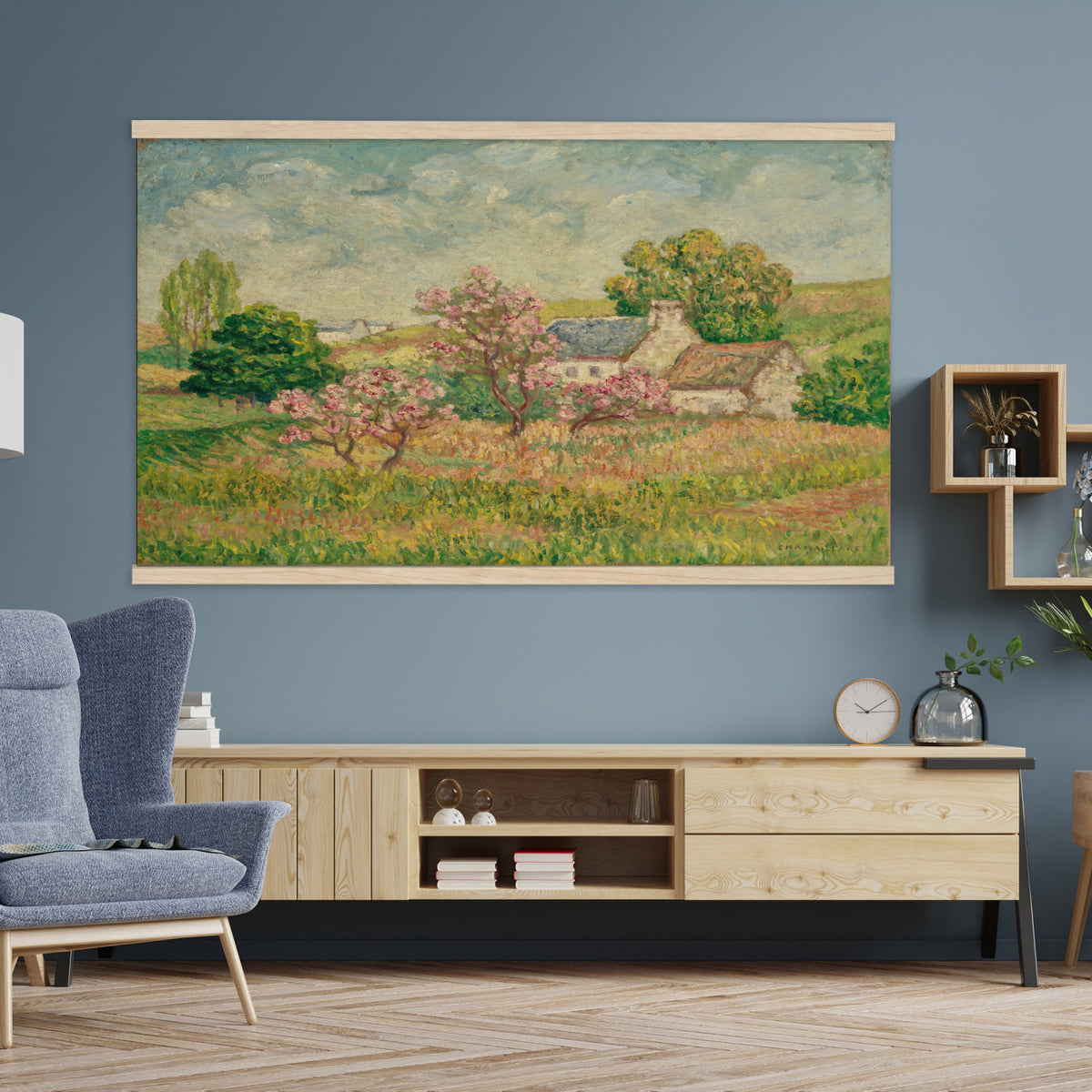 67494912-MGV-TP-30X20 - Post Impressionism oil painting tapestry wall hanging of "Spring" by Ernest de Chamaillard, showing a stone Breton cottage behind a blossoming tree in full pink bloom, with a bright spring garden around it in soft pink blossoms against grey stone walls and new spring green. Extra large wall art, made in the USA.