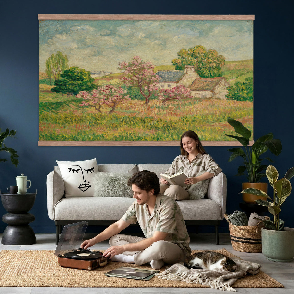67494912-MGV-TP-30X20 - Post Impressionism oil painting tapestry wall hanging of "Spring" by Ernest de Chamaillard, showing a stone Breton cottage behind a blossoming tree in full pink bloom, with a bright spring garden around it in soft pink blossoms against grey stone walls and new spring green. Extra large wall art, made in the USA.