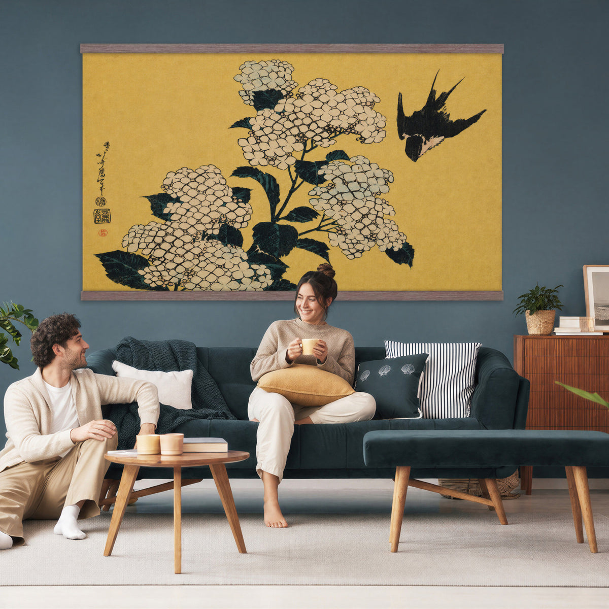 24787197-MGV-TP-30X20 - Ukiyo-e woodblock print tapestry wall hanging of "Hydrangea and Swallow" by Katsushika Hokusai, showing a swallow in flight above a full hydrangea head, drawn with the precise line of Japanese woodblock in soft blue hydrangea blooms with warm gold ground. Extra large wall art, made in the USA.