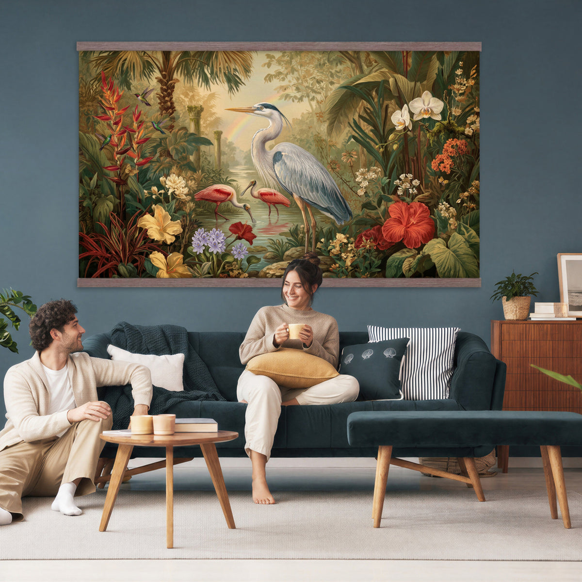 20081183-MGV-TP-30X20 - Botanical botanical illustration tapestry wall hanging of "Great Blue Heron in the Jungle", showing a great blue heron standing among hibiscus blooms, palm fronds and dense tropical foliage in deep jungle greens with red hibiscus and soft blue heron plumage. Extra large wall art, made in the USA.
