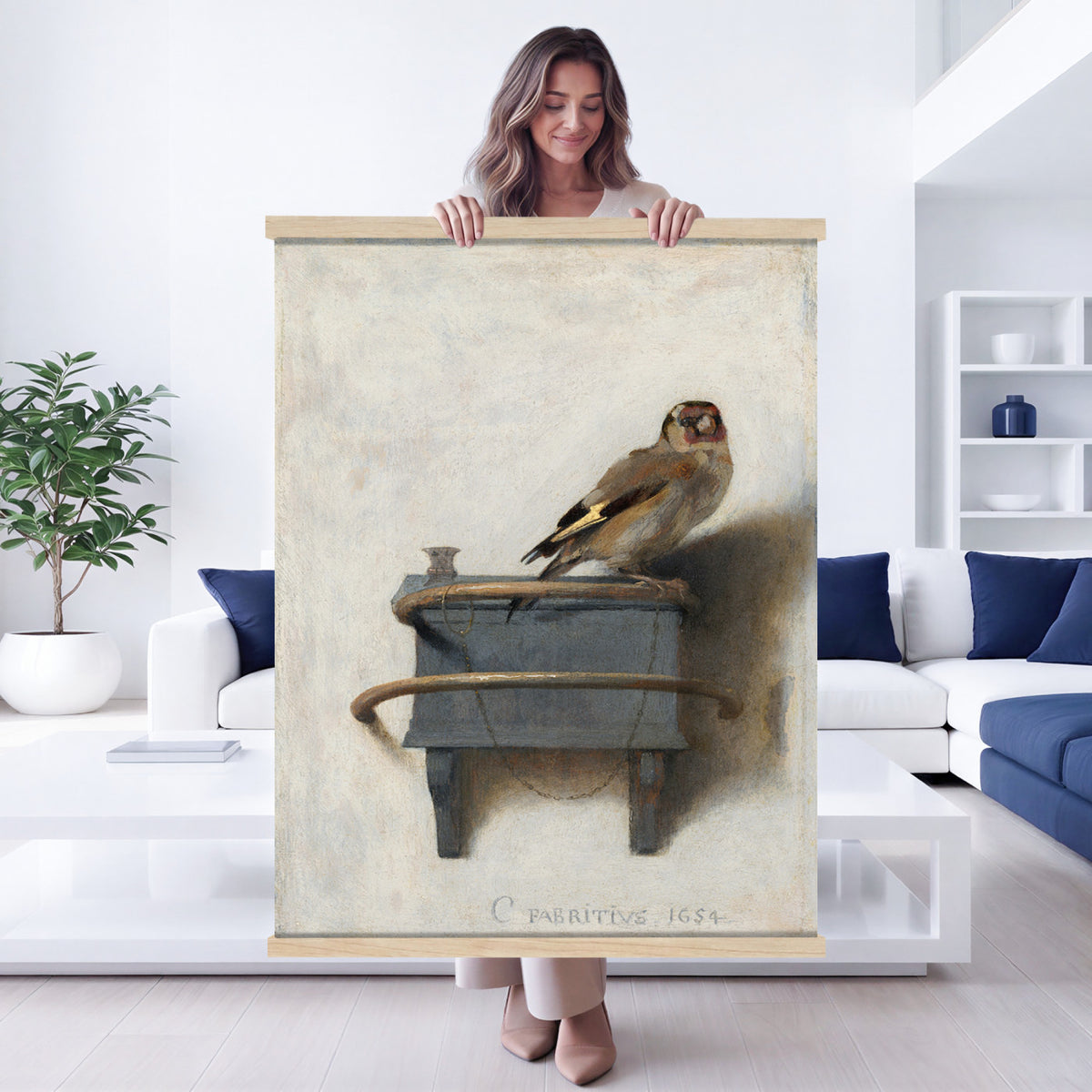 88453247-MGV-TP-24X36 - Dutch Golden Age oil painting tapestry wall hanging of "The Goldfinch" by Carel Fabritius, showing a small goldfinch chained to its feeder box, painted against a pale sunlit wall in famous trompe l'oeil detail in warm gold and black bird plumage against a pale cream sunlit wall. Extra large wall art, made in the USA.