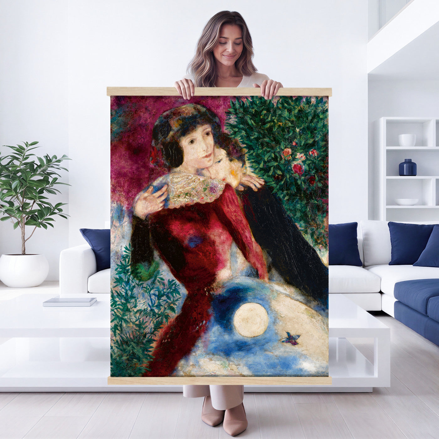 67037419-MGV-TP-24X36 - Surrealism oil painting tapestry wall hanging of "Bella with a White Collar" by Marc Chagall, showing a towering figure in a white collar above a small embracing couple, set under a soft moonlit sky in deep green foliage and soft blue sky with a pale white collar. Extra large wall art, made in the USA.
