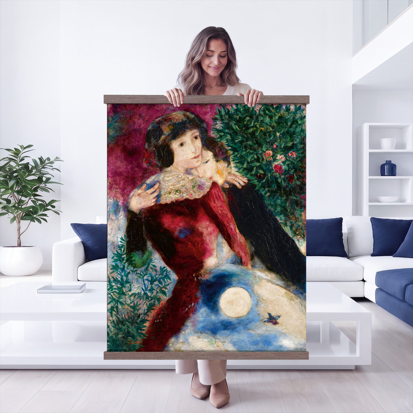 67037419-MGV-TP-24X36 - Surrealism oil painting tapestry wall hanging of "Bella with a White Collar" by Marc Chagall, showing a towering figure in a white collar above a small embracing couple, set under a soft moonlit sky in deep green foliage and soft blue sky with a pale white collar. Extra large wall art, made in the USA.