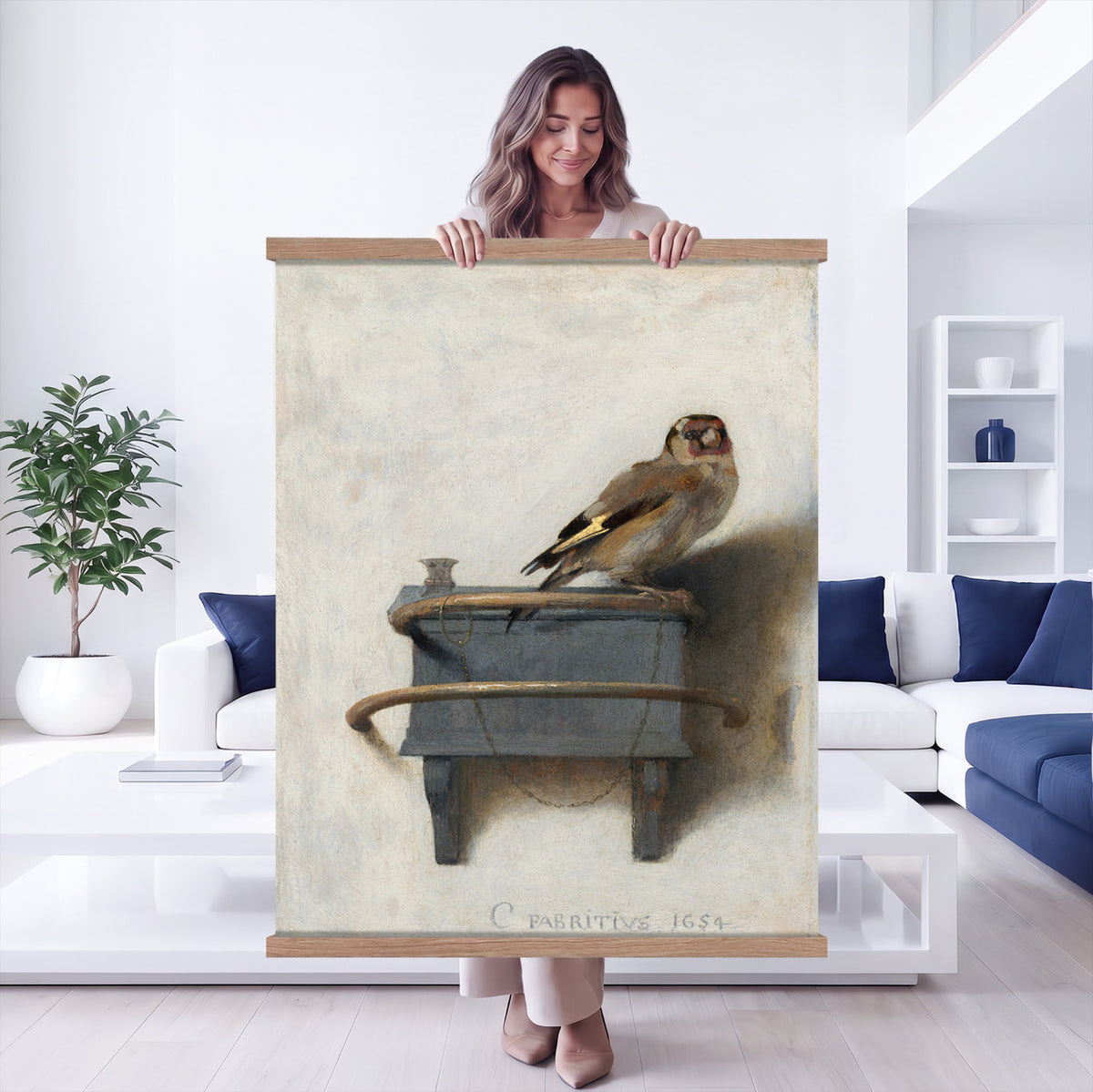 88453247-MGV-TP-24X36 - Dutch Golden Age oil painting tapestry wall hanging of "The Goldfinch" by Carel Fabritius, showing a small goldfinch chained to its feeder box, painted against a pale sunlit wall in famous trompe l'oeil detail in warm gold and black bird plumage against a pale cream sunlit wall. Extra large wall art, made in the USA.