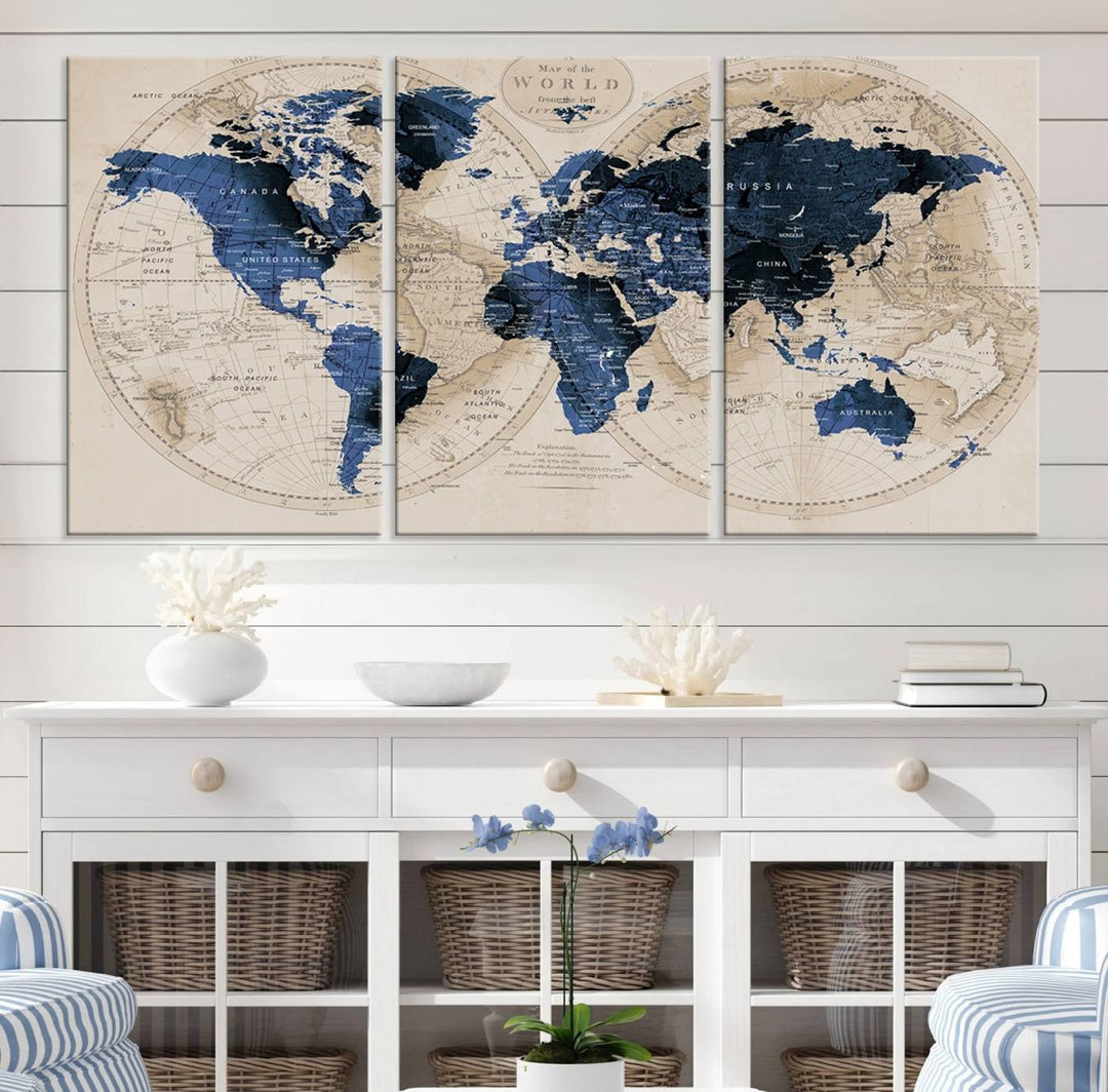 The Vintage Triptych Map Print is a grunge-stained blue and beige world map, perfect for enhancing wall decor.