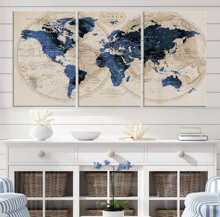 The Vintage Triptych Map Print is a grunge-stained blue and beige world map, perfect for enhancing wall decor.