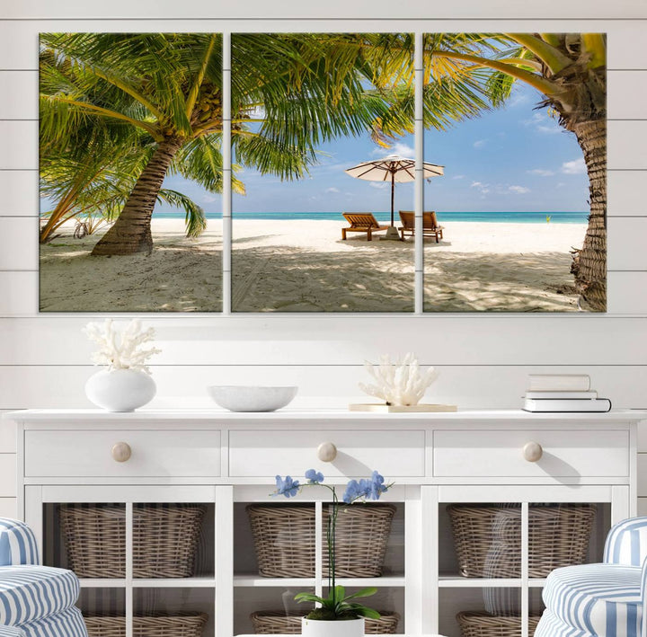 The canvas art print titled Lounge Chairs Palm Trees on Tropical Beach offers free shipping.