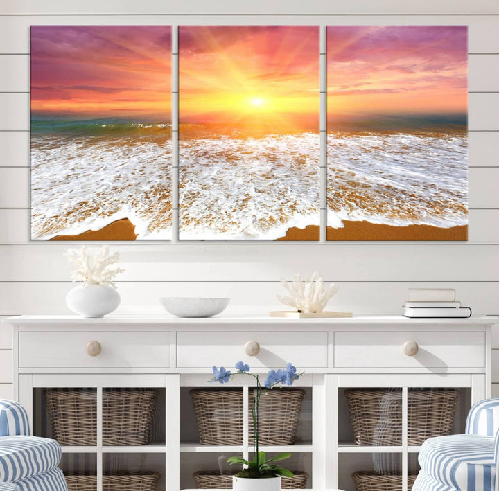 Golden Beach Sunrise 3-panel canvas art of ocean waves, hung on a wooden wall.