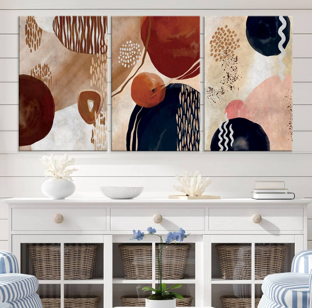 The Boho Neutral Canvas Print Set with earthy tones and circles hangs on the wall.