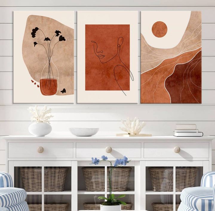 A giclée canvas triptych showcases minimalist mountain landscapes in earthy tones.