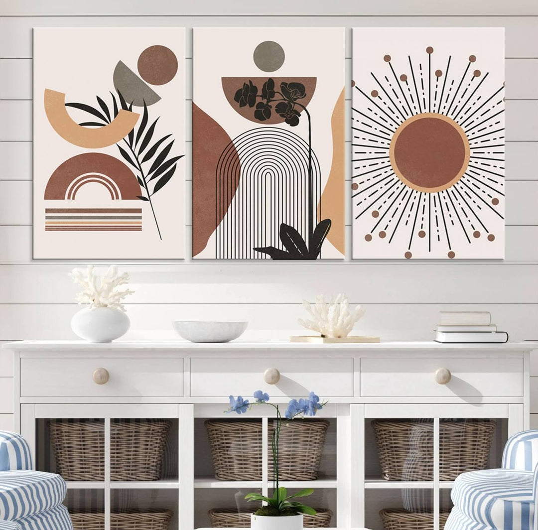 A trio of Boho Wall Art Canvas Print Sets, showcasing mid-century and bohemian styles on museum-quality canvas, adorn the wall.