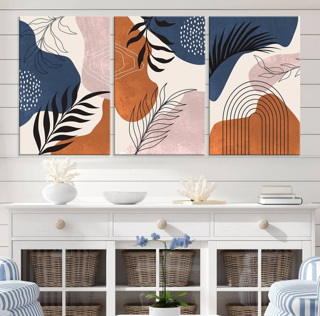 Boho Wall Art Canvas Print Set showcases mid-century geometric and leaf motifs in blue, ochre, and pink.