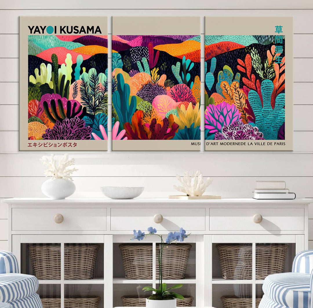 The framed Yayoi Kusama wall art adds vibrancy above the blue couch.