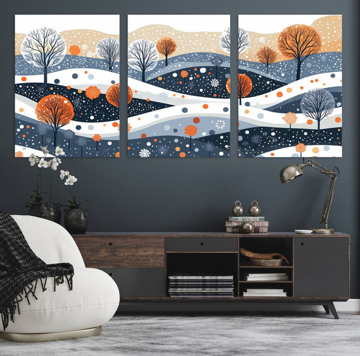 The "Abstract Winter Landscape Canvas Wall Art Print," featuring a triptych of landscapes with trees and hills in vibrant orange, white, and blue hues, adds a gallery-quality finish that transforms the space into an art lover's dream.